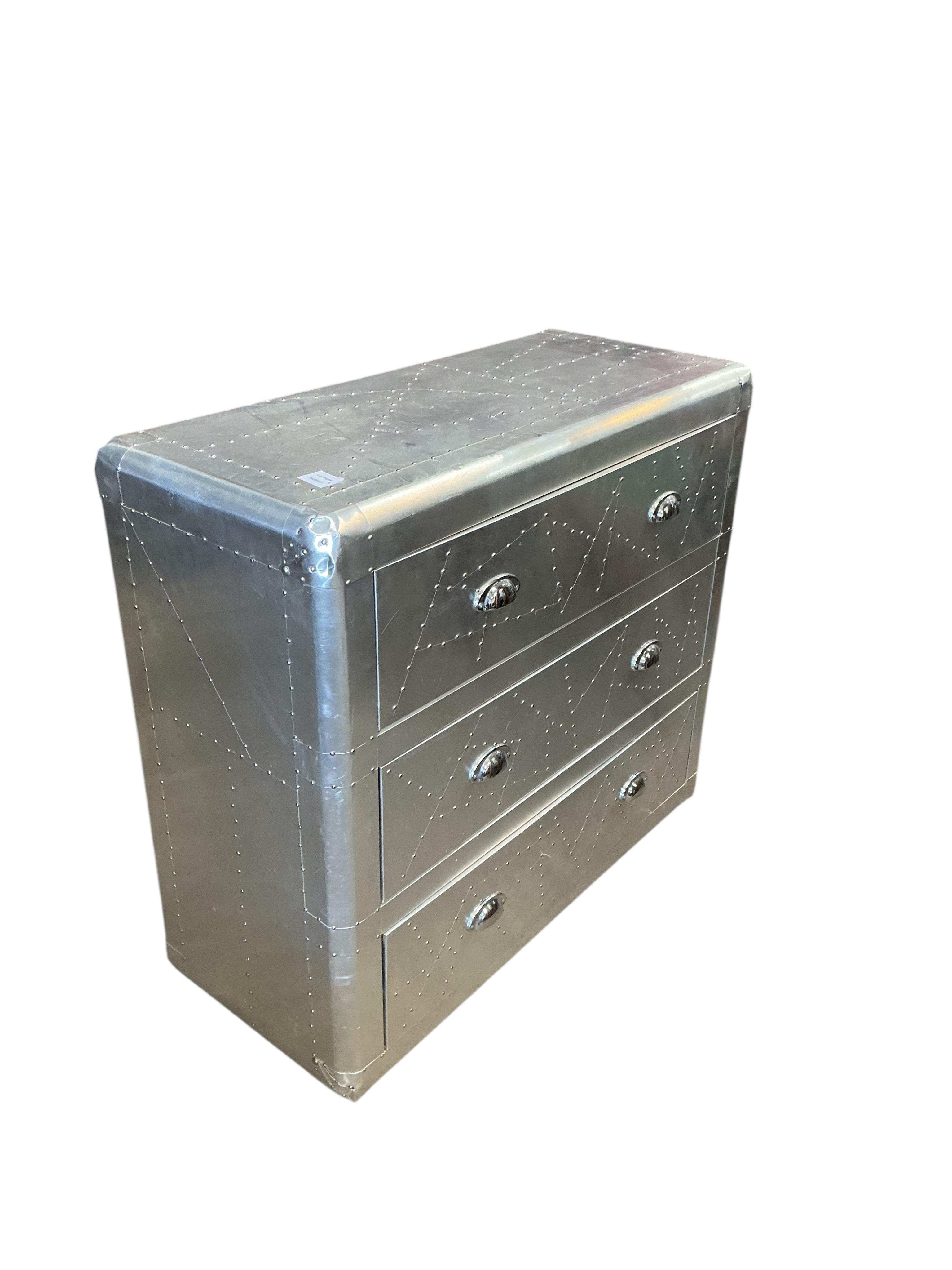 A pair of Contemporary aeronautical style aluminium mounted chest of three drawers, width 90cm, depth 38cm, height 79cm